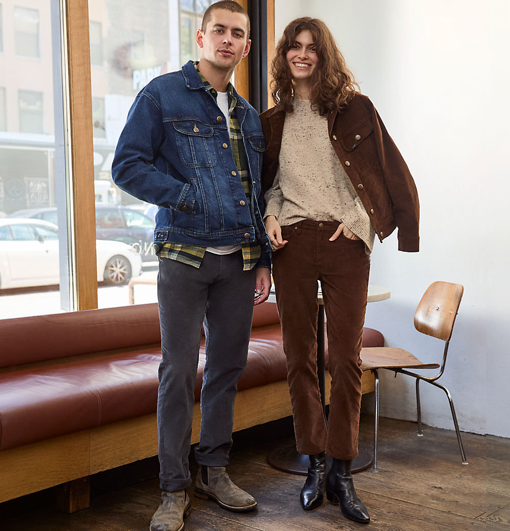 Couple in coffee shop wearing Lee Corduroy Styles